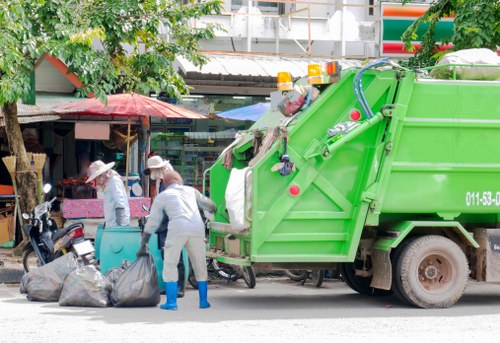 Operatives briefing on-site during rubbish removal